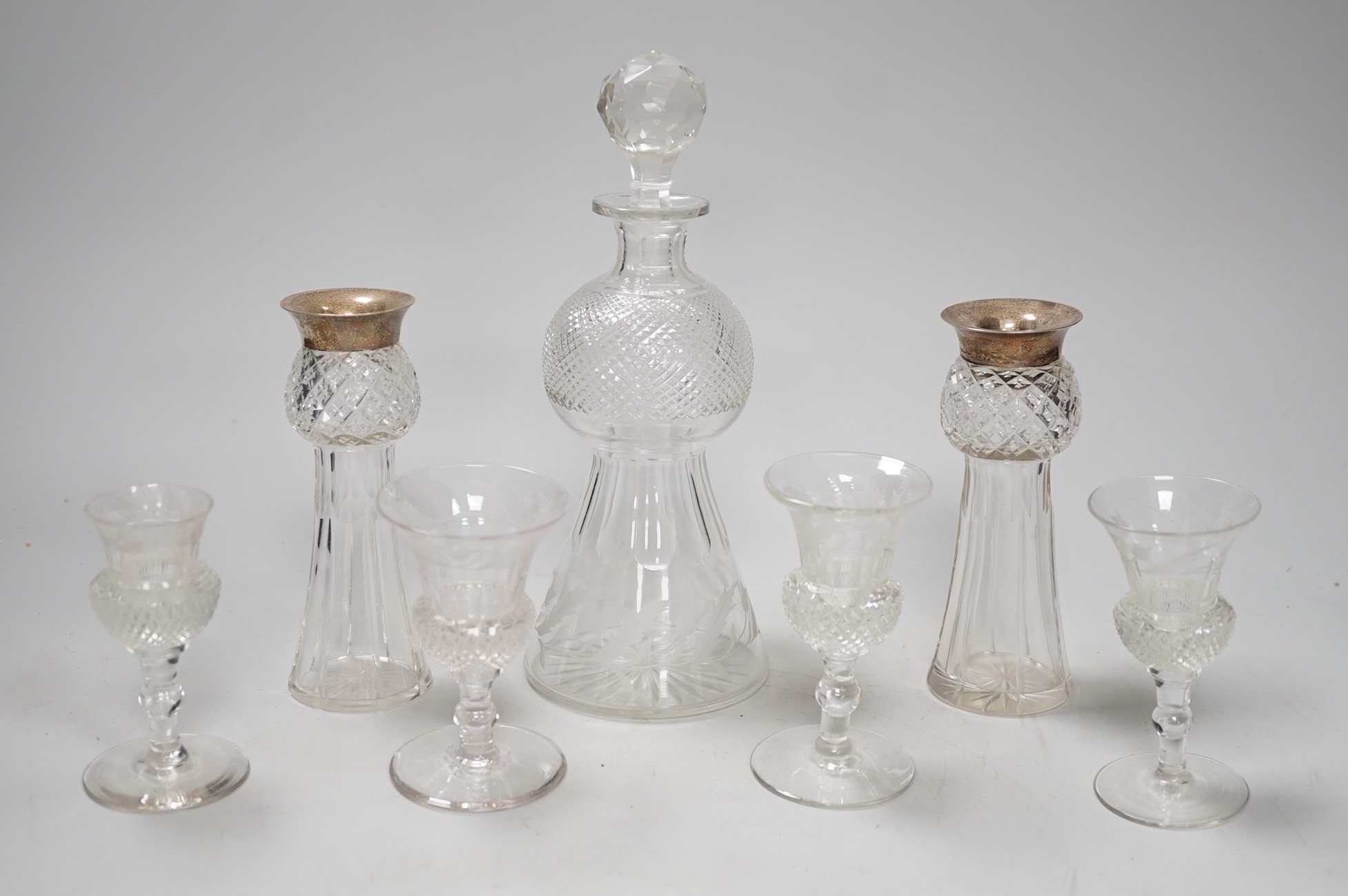 A late Victorian engraved thistle shaped liqueur decanter, 4 glasses and a pair of silver mounted jars